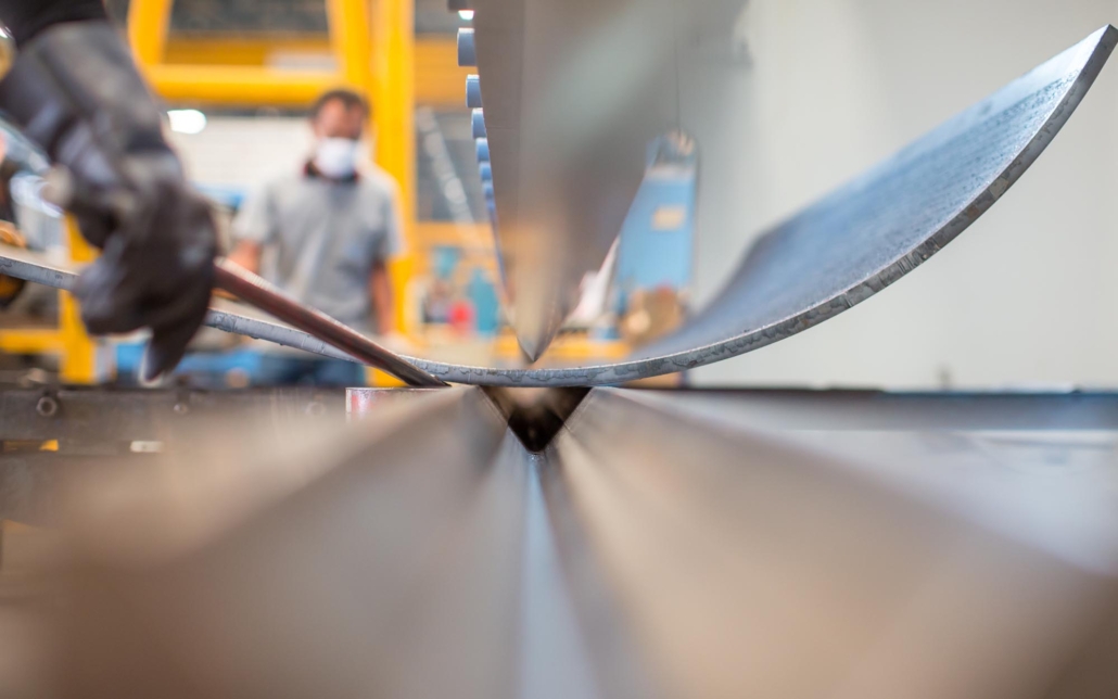 Worker fabricating sheet metal