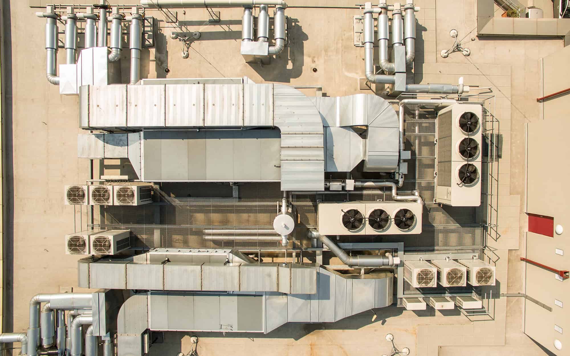 Air conditioning equipment atop a modern building - aerial_drone Air conditioning equipment atop a modern building - aerial_drone