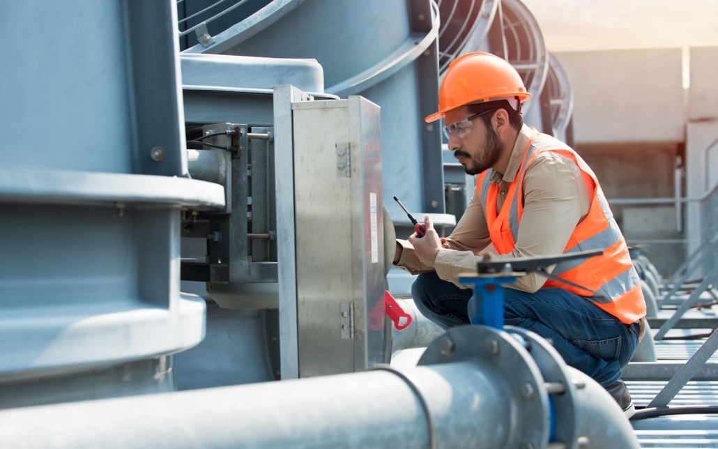 Worker inspecting HVAC system