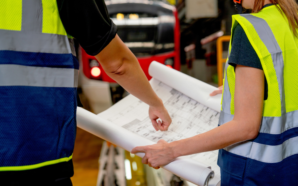 Close up hands of engineer or technician worker point to drawing paper