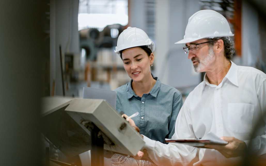 Portrait of engineer team standing and working in industrial factory