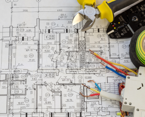 Still Life Of Electrical Components Arranged On Plans