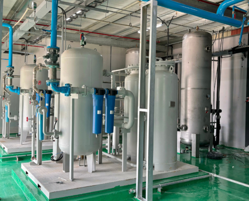 Industrial air compressor system and filtration tanks in a clean facility