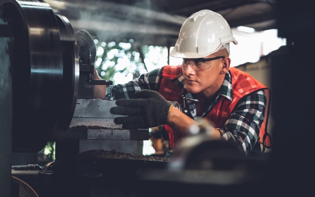 Worker inspecting machinery